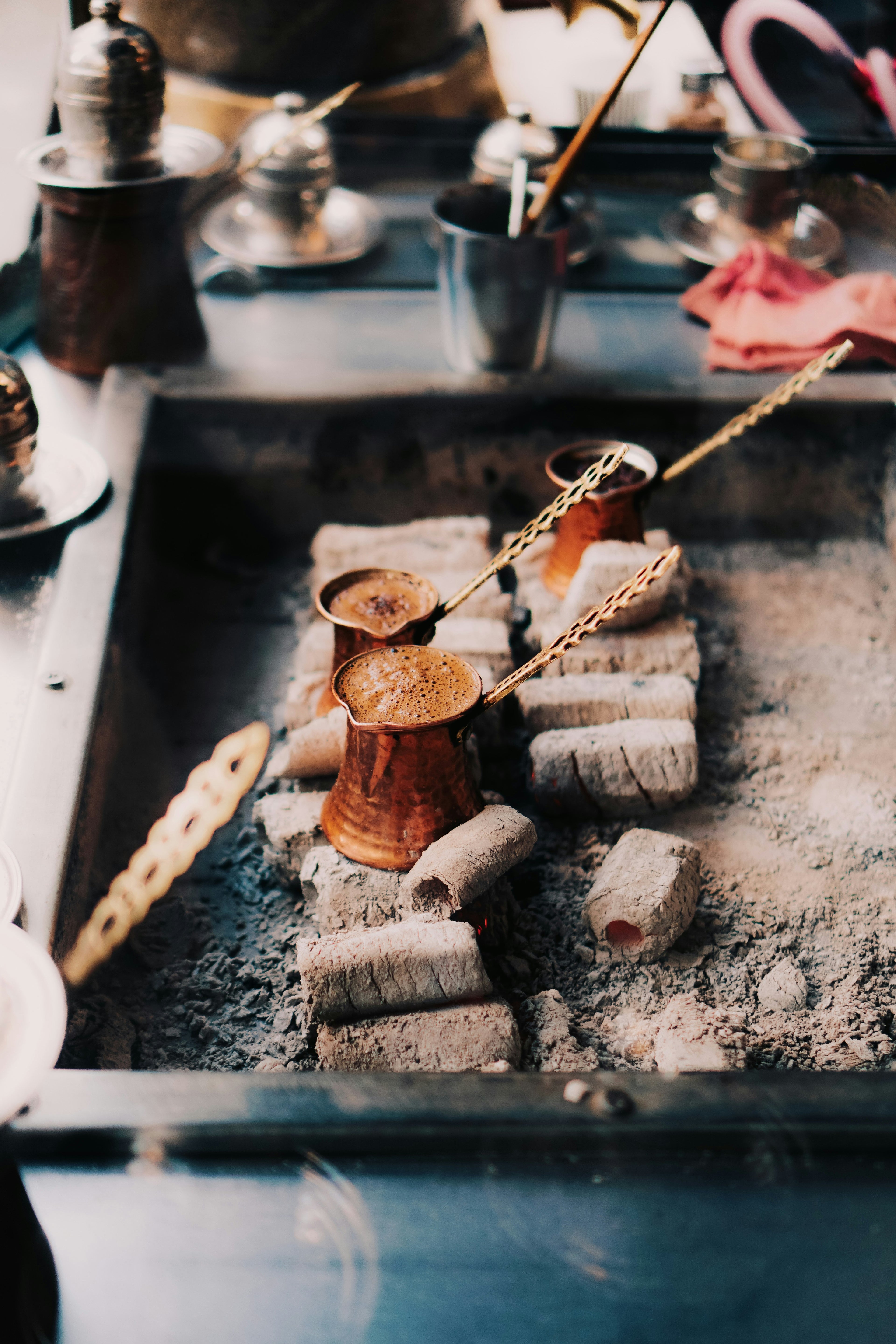 Turkish coffee brewing on hot coals